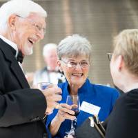 Guests laughing in the Grand Gallery at DeVos Place.